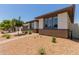 Well-maintained single-story home showcasing desert landscaping and a paved walkway to the entrance at 1166 W Silver Creek Ln, Queen Creek, AZ 85140