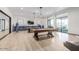 Spacious game room with pool tables, bar, and comfortable seating at 1166 W Silver Creek Ln, Queen Creek, AZ 85140