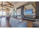 A stylish lounge area with comfortable seating, a fireplace, and modern decor at 1166 W Silver Creek Ln, Queen Creek, AZ 85140