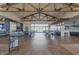 Spacious lounge with modern decor, fireplace, and bar, perfect for relaxing and entertaining guests at 1166 W Silver Creek Ln, Queen Creek, AZ 85140