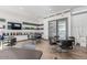 Well-lit meeting area features a large table, comfortable chairs, and shelving, ideal for collaboration and discussions at 1166 W Silver Creek Ln, Queen Creek, AZ 85140