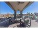 Inviting poolside lounge area with comfortable seating, shade, and clear views of the pool, perfect for relaxation at 1166 W Silver Creek Ln, Queen Creek, AZ 85140