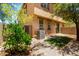A cozy backyard area with low-maintenance landscaping and mature trees for shade at 1250 S Rialto -- # 78, Mesa, AZ 85209