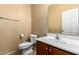 This well-lit bathroom boasts a modern sink and toilet, offering a clean and functional space at 1250 S Rialto -- # 78, Mesa, AZ 85209
