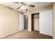 This bedroom includes carpet, a ceiling fan, and a sliding closet with storage at 1250 S Rialto -- # 78, Mesa, AZ 85209
