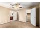 Bedroom showcasing carpet, ceiling fan, and easy access to the bathroom and a walk-in closet at 1250 S Rialto -- # 78, Mesa, AZ 85209