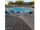 Outdoor community pool with lounge chairs and tables for residents at 1250 S Rialto -- # 78, Mesa, AZ 85209