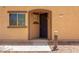 Close-up of the front entrance featuring security screen door and charming light fixture at 1250 S Rialto -- # 78, Mesa, AZ 85209