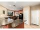 Well-lit kitchen with granite countertops, sleek black appliances, and tiled floor at 1250 S Rialto -- # 78, Mesa, AZ 85209