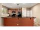 Modern kitchen with dark countertops, stainless steel appliances, and ample cabinet space at 1250 S Rialto -- # 78, Mesa, AZ 85209