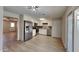 Well-lit kitchen with stainless steel appliances, tile backsplash, ample storage and vinyl floors at 14002 N 38Th St, Phoenix, AZ 85032