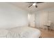 Bright bedroom featuring a ceiling fan, carpet, closet and natural light from the window at 14099 W Riviera Dr, Surprise, AZ 85379