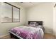 Bedroom featuring a ceiling fan, carpet, window and neutral paint at 14099 W Riviera Dr, Surprise, AZ 85379