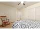 This bedroom has a ceiling fan and a closet with plenty of storage space at 14099 W Riviera Dr, Surprise, AZ 85379