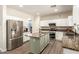 Well-appointed kitchen featuring stainless steel appliances, granite counters and kitchen island at 14099 W Riviera Dr, Surprise, AZ 85379