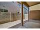 Covered patio in a backyard with a block wall and gravel landscaping at 1420 E Sonrisas St, Phoenix, AZ 85040