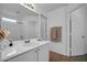 Bright bathroom with a sink, large mirror, and a shower/tub combo at 1420 E Sonrisas St, Phoenix, AZ 85040