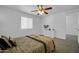 Cozy bedroom with neutral tones and natural lighting, ceiling fan at 1420 E Sonrisas St, Phoenix, AZ 85040