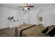 Nicely decorated bedroom features ceiling fan and closet entrance at 1420 E Sonrisas St, Phoenix, AZ 85040