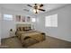 Comfortable bedroom with neutral tones, fan and plenty of natural light at 1420 E Sonrisas St, Phoenix, AZ 85040