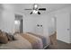 Bright bedroom with ceiling fan, access to bathroom, and white trim at 1420 E Sonrisas St, Phoenix, AZ 85040