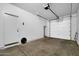 Clean and spacious garage featuring an automatic door and side entry at 1420 E Sonrisas St, Phoenix, AZ 85040