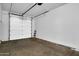 Spacious two-car garage featuring an automatic door and ample storage space at 1420 E Sonrisas St, Phoenix, AZ 85040