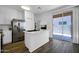 Bright, all-white kitchen featuring stainless steel appliances, white countertops, and a modern aesthetic at 1420 E Sonrisas St, Phoenix, AZ 85040