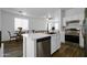 Bright kitchen with stainless steel appliances, open to the dining and living areas at 1420 E Sonrisas St, Phoenix, AZ 85040