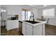 Bright kitchen with stainless steel appliances, open to the dining area and access to backyard at 1420 E Sonrisas St, Phoenix, AZ 85040