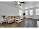 Bright living room features a comfortable sectional sofa and stylish wood-look flooring at 1420 E Sonrisas St, Phoenix, AZ 85040