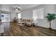 Bright living room featuring wood-look floors, neutral walls, and an open layout at 1420 E Sonrisas St, Phoenix, AZ 85040