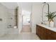 Modern bathroom featuring dual vanity, glass shower, and modern tub at 14401 N 60Th Pl, Scottsdale, AZ 85254