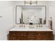 Bathroom features a double sink vanity, a large mirror, and stylish gold fixtures at 14401 N 60Th Pl, Scottsdale, AZ 85254