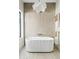 Modern soaking tub features unique lighting and a serene ambiance at 14401 N 60Th Pl, Scottsdale, AZ 85254
