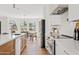 Open-concept kitchen showcasing stainless steel appliances, a large island, and dining area at 14401 N 60Th Pl, Scottsdale, AZ 85254