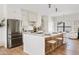 Modern kitchen with stainless steel appliances, white cabinets, and a spacious island with seating at 14401 N 60Th Pl, Scottsdale, AZ 85254