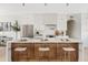 Well-lit kitchen with a large island, stainless steel appliances, and white cabinetry at 14401 N 60Th Pl, Scottsdale, AZ 85254
