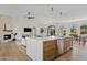 Island view of bright, open floor plan with white countertops, stainless appliances, and eat-in dining area at 14401 N 60Th Pl, Scottsdale, AZ 85254