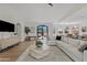 Spacious living room with a plush sofa, modern furniture, and large windows for natural light at 14401 N 60Th Pl, Scottsdale, AZ 85254