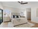 Serene primary bedroom featuring a stylish rug and a cooling ceiling fan at 14401 N 60Th Pl, Scottsdale, AZ 85254