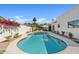 Inviting backyard pool with a sunshade, lush landscaping and manicured surroundings at 14401 N 60Th Pl, Scottsdale, AZ 85254