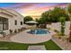 Cozy backyard pool area with pavers, desert landscaping, and a relaxing atmosphere at 14401 N 60Th Pl, Scottsdale, AZ 85254