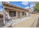 Covered patio in backyard with beige exterior paint and gravel landscaping at 15853 N 74Th Ave, Peoria, AZ 85382