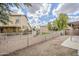 Private backyard with block fence and low-maintenance gravel landscaping at 15853 N 74Th Ave, Peoria, AZ 85382