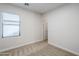 Bedroom with neutral carpet, a window and a closet at 15853 N 74Th Ave, Peoria, AZ 85382