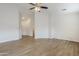 Open-concept floor plan with wood-look floors and lots of natural light at 15853 N 74Th Ave, Peoria, AZ 85382