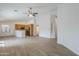 Open floor plan featuring spacious living area and kitchen with stainless appliances at 15853 N 74Th Ave, Peoria, AZ 85382
