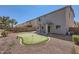 Spacious backyard with putting green and desert landscaping at 15955 N Cristine Ln, Surprise, AZ 85388