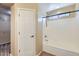 Clean bathroom with a bathtub-shower combination and a window for natural light at 15955 N Cristine Ln, Surprise, AZ 85388